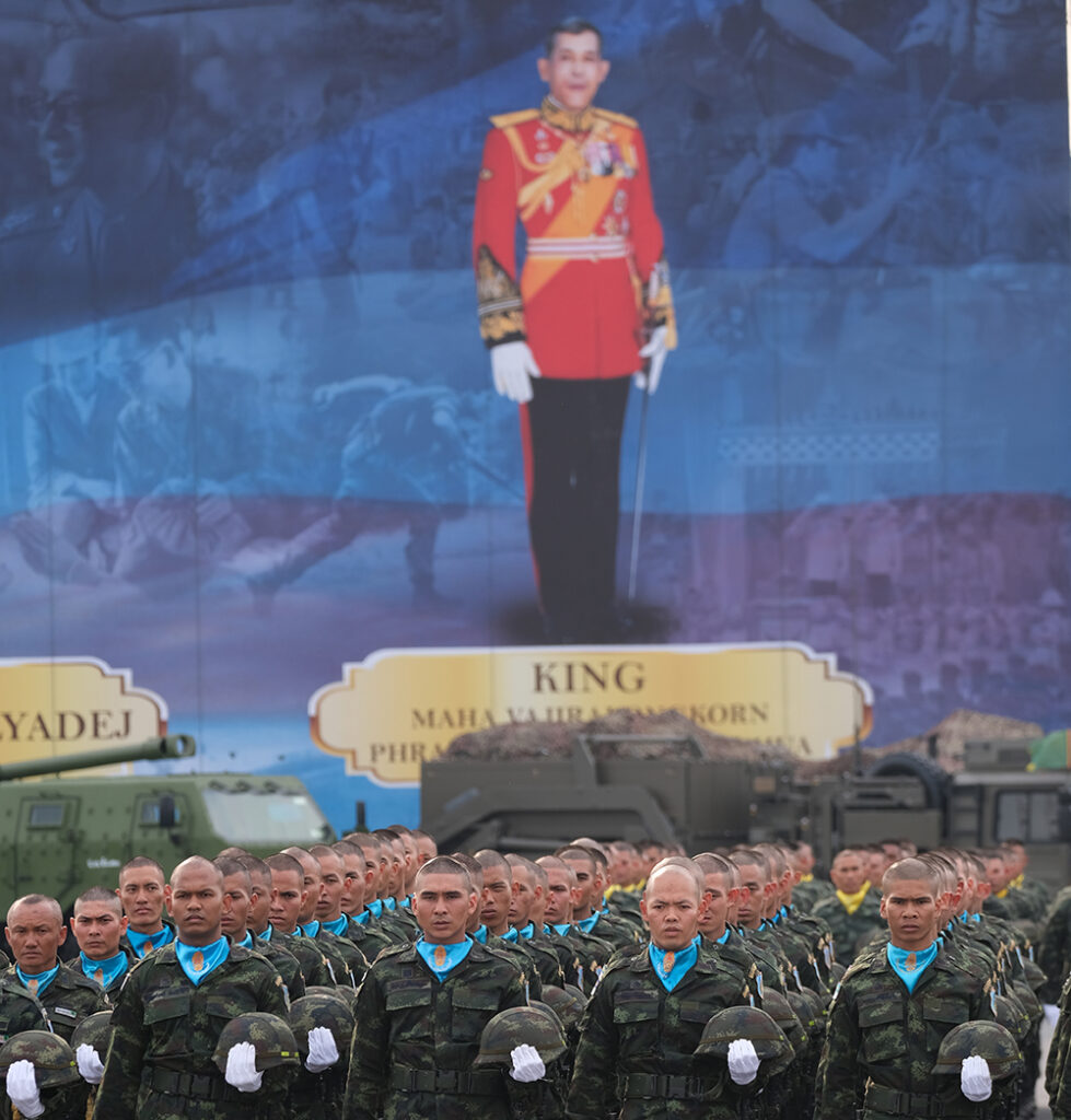 Saraburi, Thailand - Jan 18, 2023: Royal Thai Army troops standing in front of the huge portrait of the King Chulalongkorn, King Bhumibol, and King Vajiralongkorn during the oathtaking ceremony. Photo: Analayo Korsakul, Shutterstock