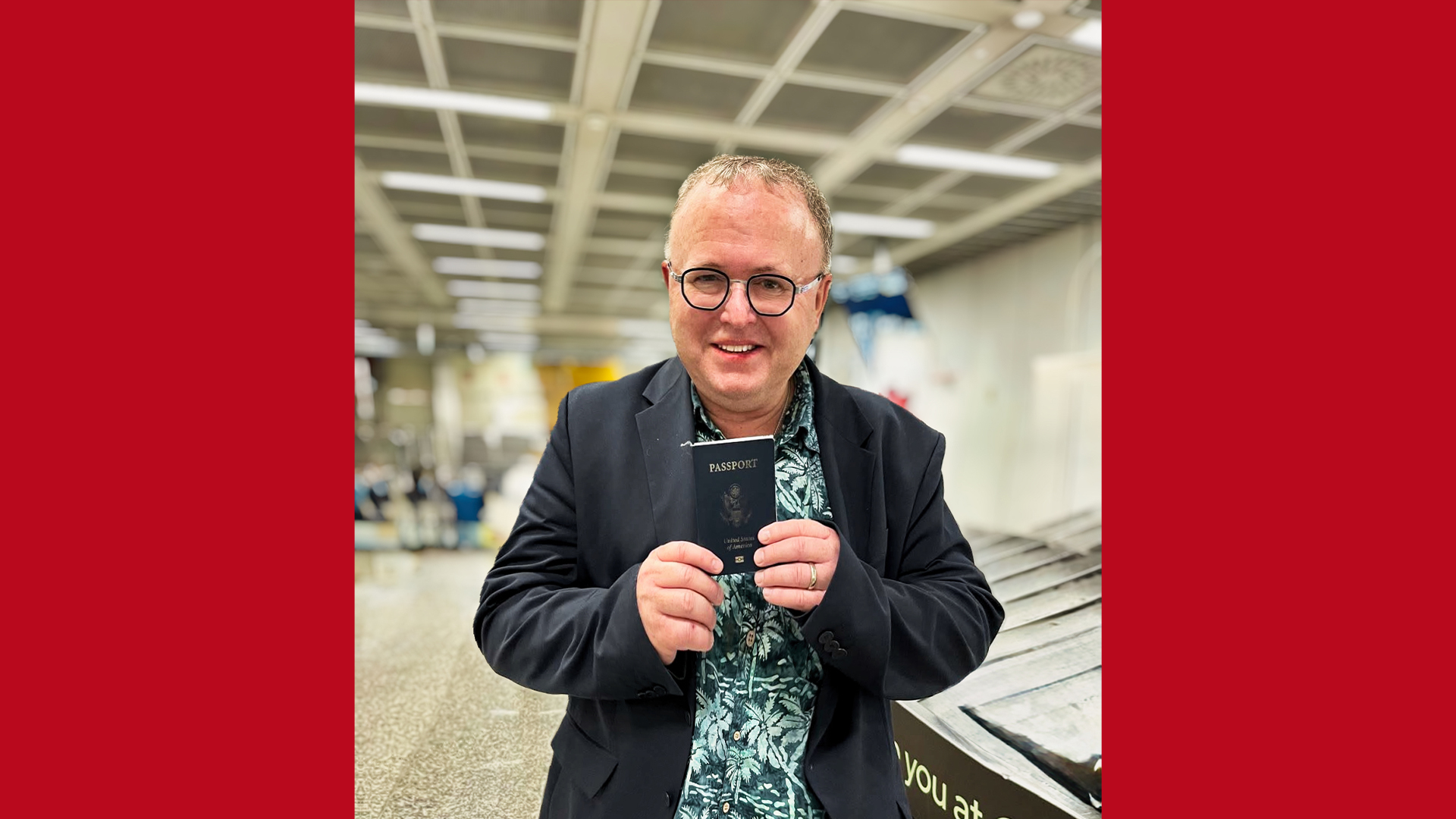 Paul Chambers holding passport Paul Chambers holding passport